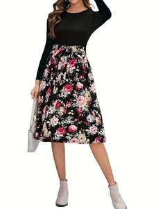 Elegant long sleeve patchwork dress featuring black top and floral print A-line skirt