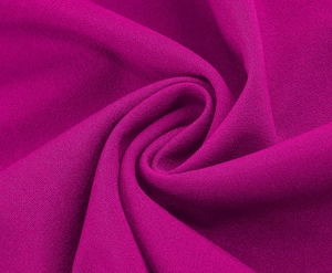 Detail shot of magenta chiffon fabric showing high-quality texture and elegant drape