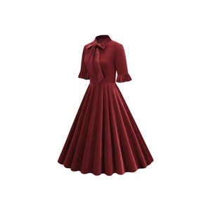 Detail of burgundy velvet dress featuring a bow neckline and ruffled sleeve cuffs