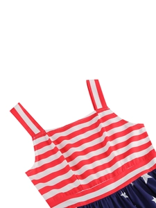 Detailed view of patriotic dress featuring red stripes and white stars on blue fabric