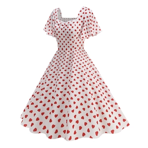 Detail of square neckline and flutter sleeves on vintage white dress with red heart print