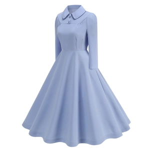 Detail of light blue vintage dress featuring a Peter Pan collar and decorative buttons