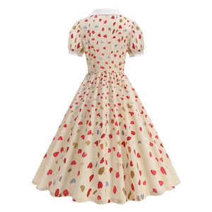 Detail view of the back of a vintage swing dress featuring a colorful heart pattern