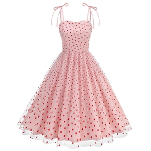 Detail showing pink mesh dress with red heart embroidery and delicate tie straps