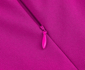 Detail of hidden zipper on magenta georgette fabric with textured finish for dresses