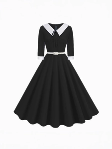 Elegant vintage Hepburn-style black dress with white Peter Pan collar and belt