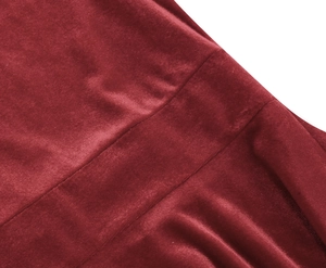 Macro shot of dark red velvet fabric texture with soft glossy finish and refined seams