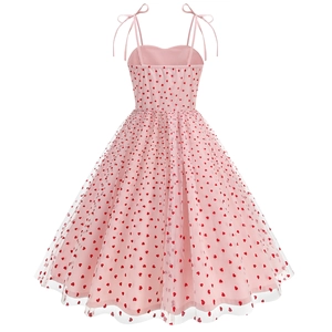 Detailed view of pink mesh dress with red heart embroidery and bow shoulder straps