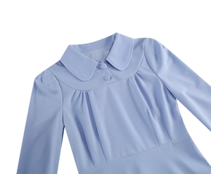 Detail of light blue vintage dress featuring a Peter Pan collar and pleated chest design