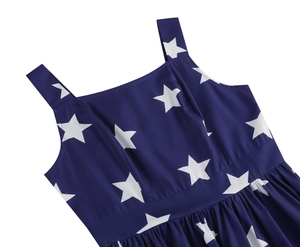 Close-up of star-patterned navy dress featuring wide shoulder straps and square neckline
