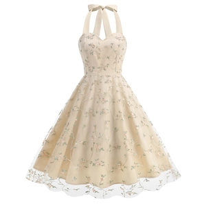 Detailed embroidery of pink flowers and green vines on a beige mesh halter dress