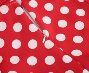 Detail view of the high-quality invisible back zipper on red polka dot cotton dress