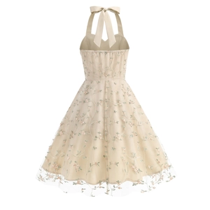 Close-up of elegant halter neck strap with bow tie detail and floral mesh embroidery