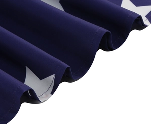 Detail of navy blue star print fabric with high-quality stitching on a summer dress