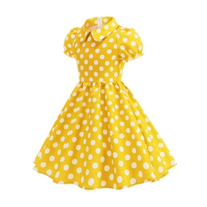 Close-up of yellow polka dot dress with bubble sleeves and a Peter Pan collar