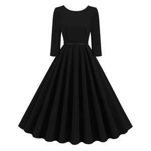 Detailed view of black vintage dress with three-quarter sleeves and matching belt