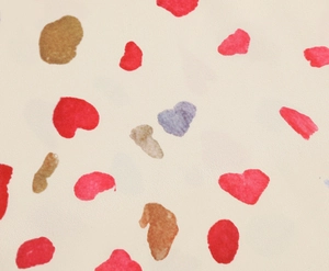 Detail shot of heart petal print fabric with soft mesh texture on summer dress