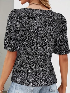Rear view of elegant V-neck floral short sleeve blouse with delicate black and white print