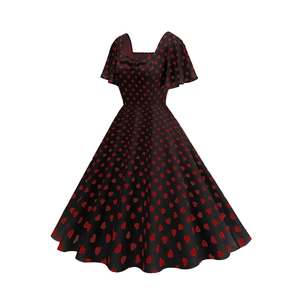 Close-up detail of retro square neck and red heart print on the black vintage dress