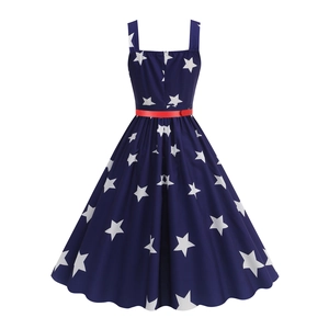 Retro dark blue sleeveless dress with white star print and red belt detail