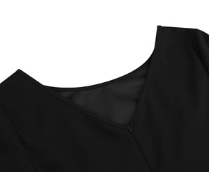 Close-up of V-neckline with invisible zipper on this elegant black three-quarter sleeve dress
