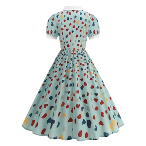 Back view of light blue vintage dress with colorful heart print and retro high waist cut