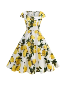 Close-up of retro lemon print fabric with square neckline on white summer dress