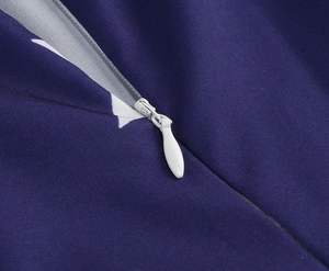 Detail of invisible zipper closure on dark blue fabric with white star pattern
