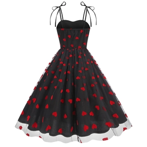 Close-up of black mesh strap dress featuring red heart embroidery and fine mesh texture