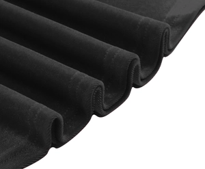 Detailed close-up showing the soft velvet fabric texture and elegant black draping folds