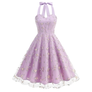 Detail of floral embroidery on lavender mesh fabric of a sleeveless evening gown