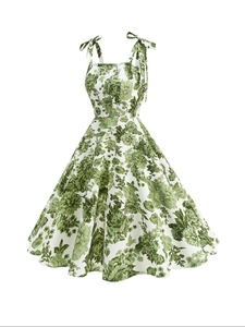 Close-up detail of adjustable ribbon bow straps on a vintage floral A-line dress