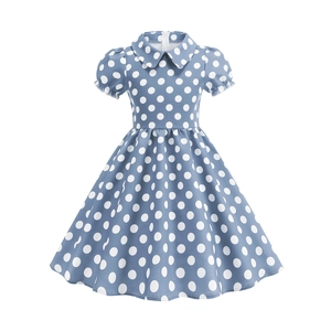 Detail of light blue polka dot girl dress featuring Peter Pan collar and puff sleeves