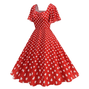 Detailed front view of a vintage red midi dress with white heart patterns and square neckline