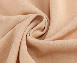 Détail macro du tissu textile nude de haute qualité avec texture fine et drapé