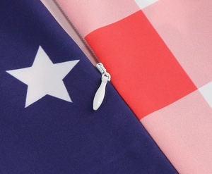 Detail of invisible zipper on patriotic stars and stripes pattern summer dress fabric