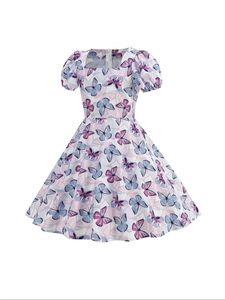 Close-up of girls' summer dress featuring butterfly prints and hidden back zipper