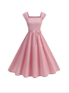 Detail view of pink vintage A-line dress featuring square neck and waist ribbon bow