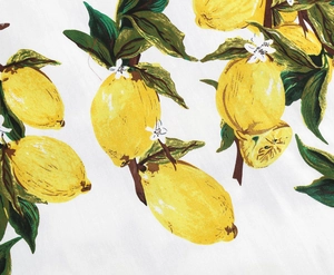 Close-up detail of the elegant lemon print fabric with bright yellow fruit and green leaves