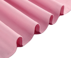 Detail view of pink cotton sleeveless dress showing fine fabric texture and double-stitch hem