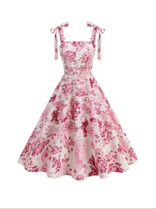 Vintage floral A-line swing dress with bow-tie straps and elegant pink flower patterns