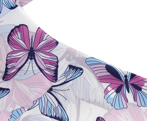 Detailed close-up of white fabric with pink and blue butterfly print for girls' dresses