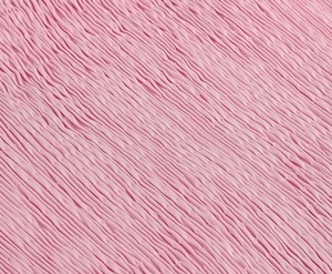 Detail view of pink sleeveless dress with elasticated smocked fabric and textured pleats