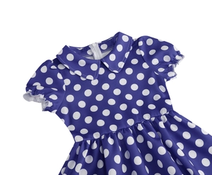 Close-up of the hidden back zipper and polka dot fabric texture on the cotton dress