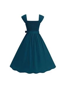 Detail of dark teal vintage A-line dress with smocked bodice and bow belt detail
