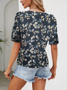 Detail view showing back and side profile of navy blue floral short sleeve blouse