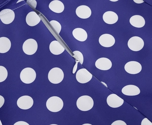 Close-up of the invisible white zipper on the blue polka dot cotton dress fabric