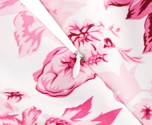 Detail of the invisible zipper and pink floral print on this elegant midi dress