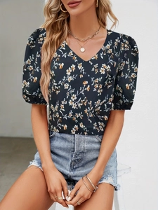Elegant floral V-neck puff sleeve blouse for women paired with denim shorts
