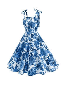 Detail of vintage floral print fabric and adjustable bow shoulder straps on the dress